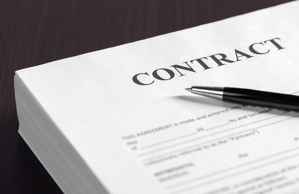 a AST landlord contract with a pen sat on top of it