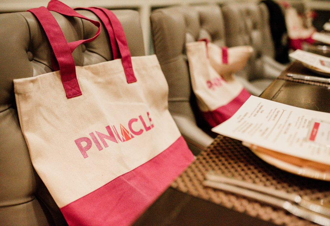 Pinnacle Women's Conference bags on display.