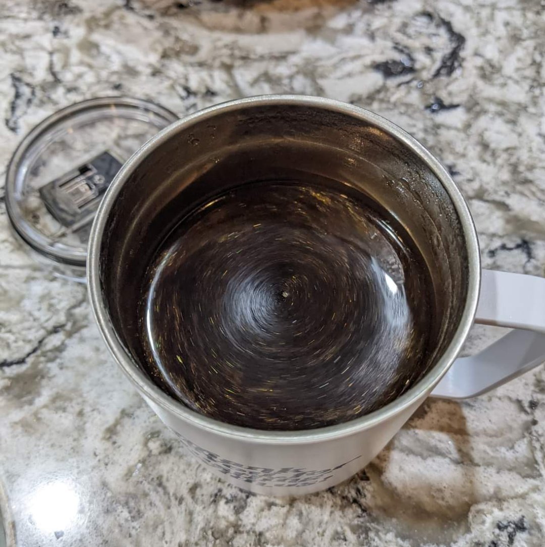  cup of coffee with glitter swirling