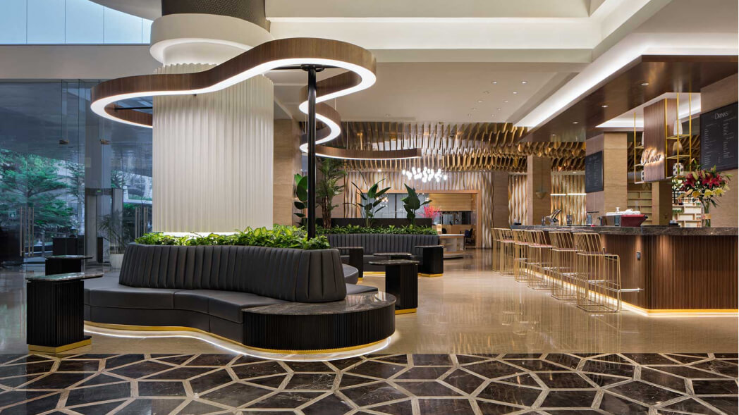 A custom design sofa and a bar for JS Luwansa's hotel reception.