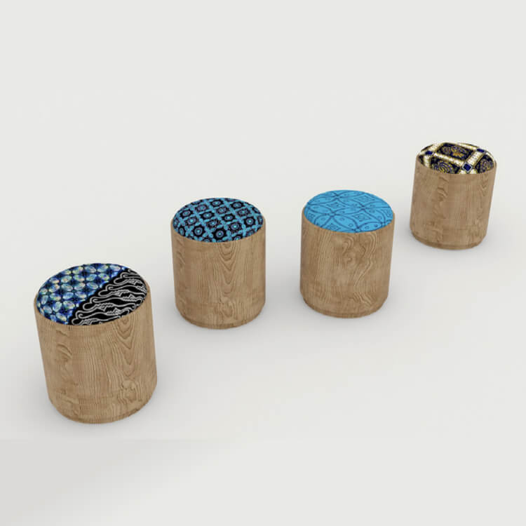 Four wooden stools with batik fabric as cushioning.