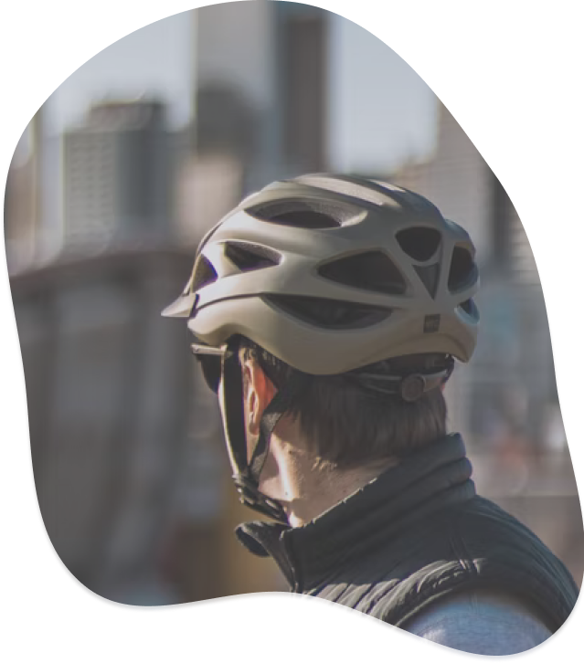 Man wearing bicycle helmet facing away