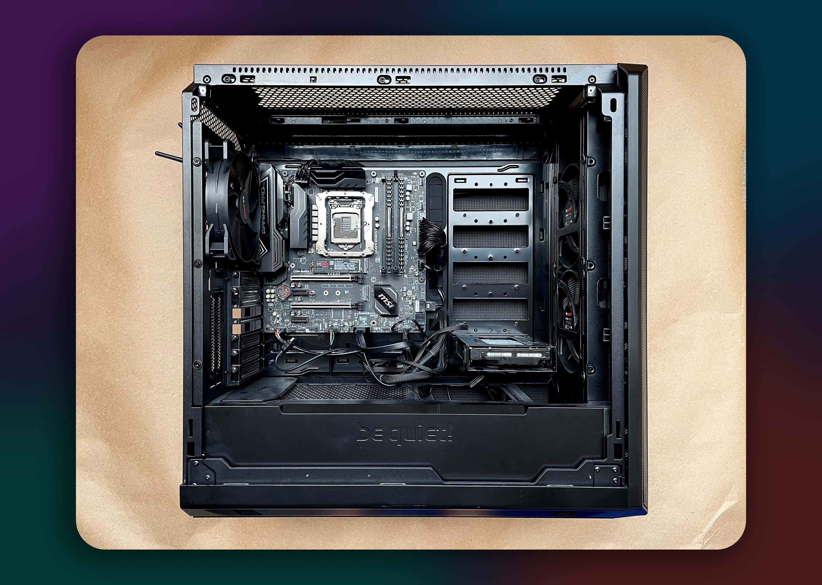 A computer with an open side panel. The SSD, HDD, and RAM have been installed.