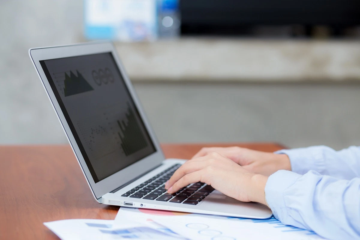 man working with decentralized finance platform on laptop