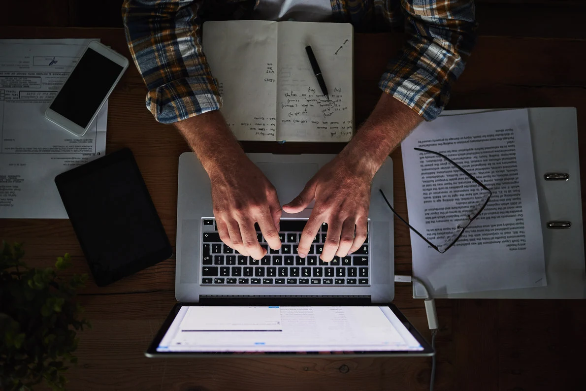 DAO worker using his laptop