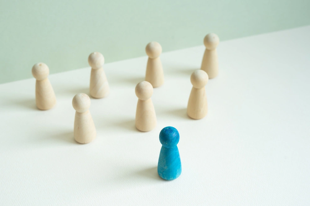 Wooden figure on wooden table concept of command room with leader