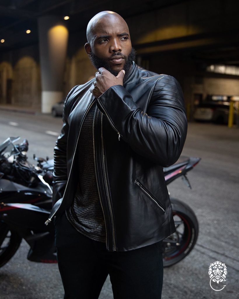 A CADOGAN model posing in front of a sports bike