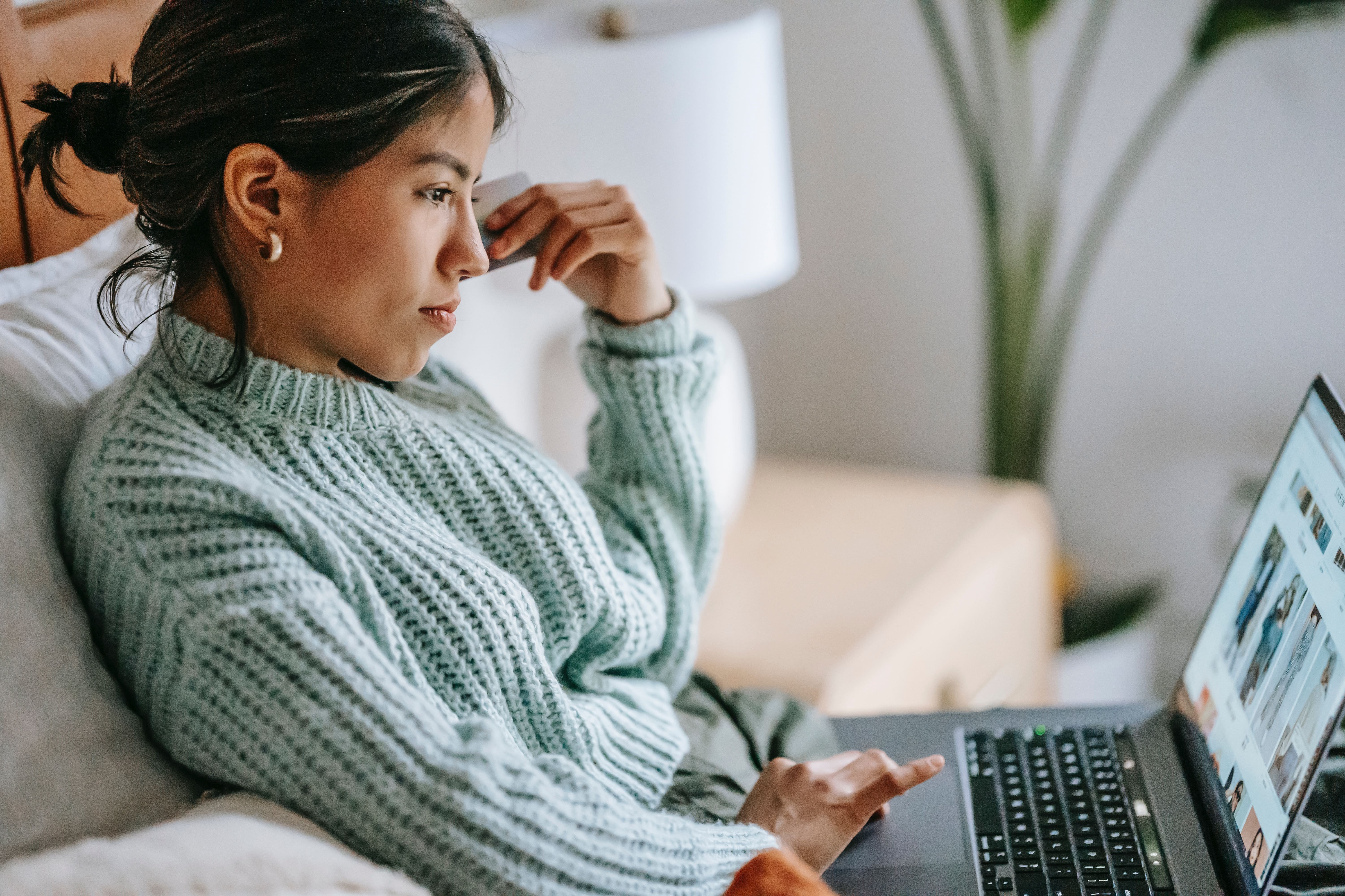 A female shopper looking at inline reviews for apparel