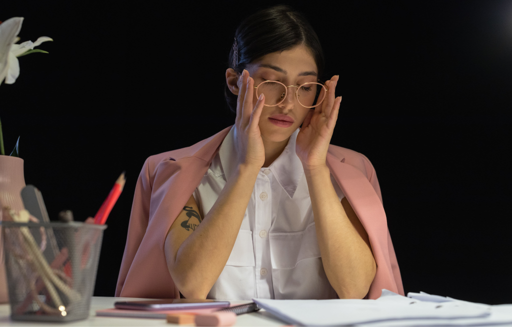 An ecommerce executive looking stressed at her desk