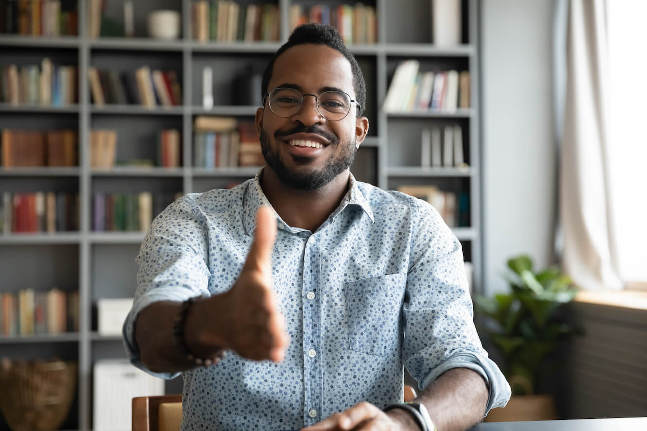 man stretching out hand to shake