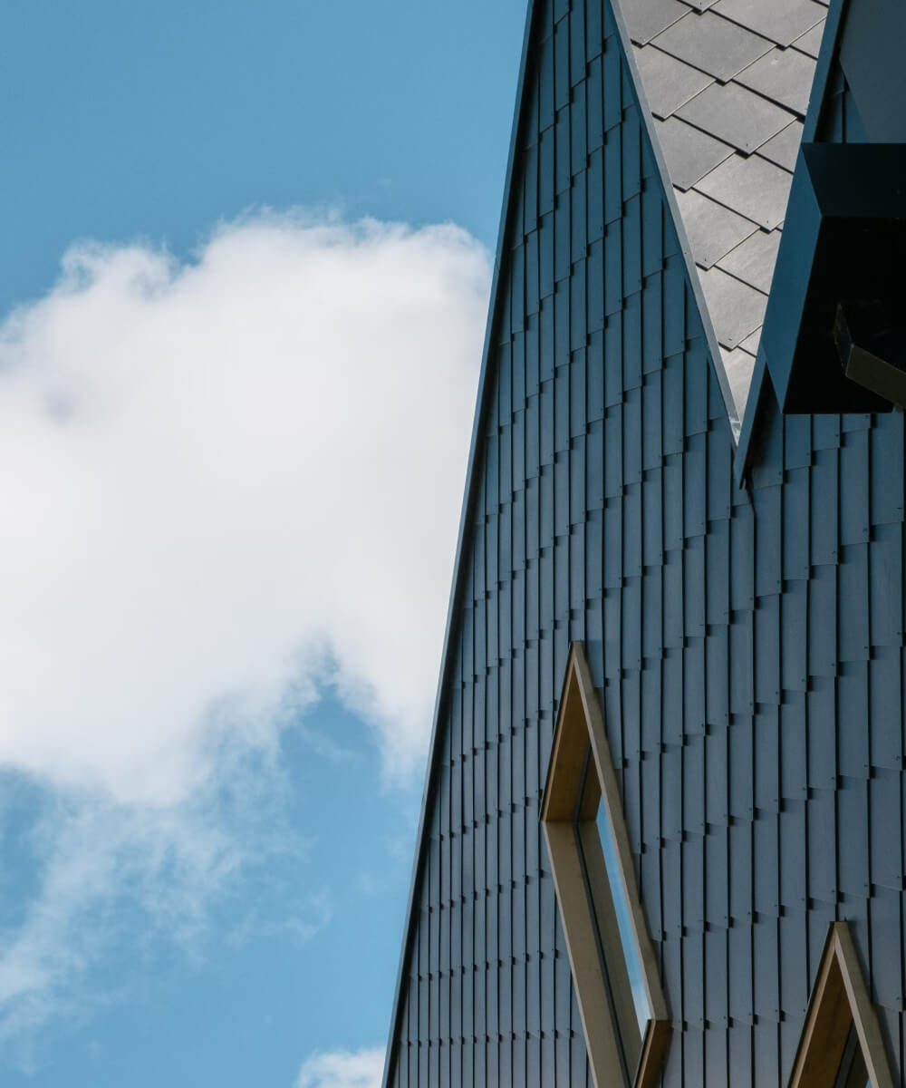 a tall building with a blue sky