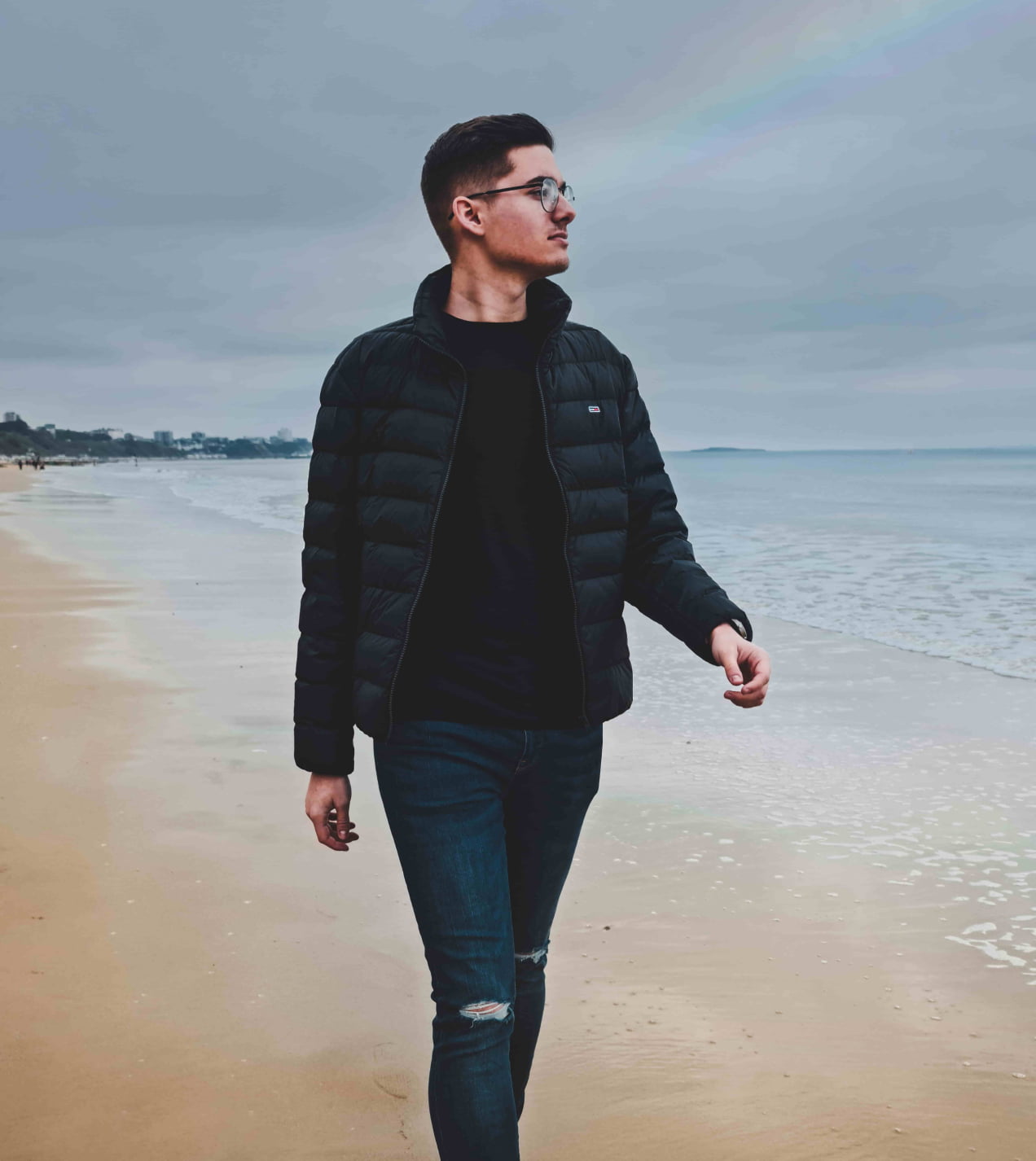Web designer walking on the beach