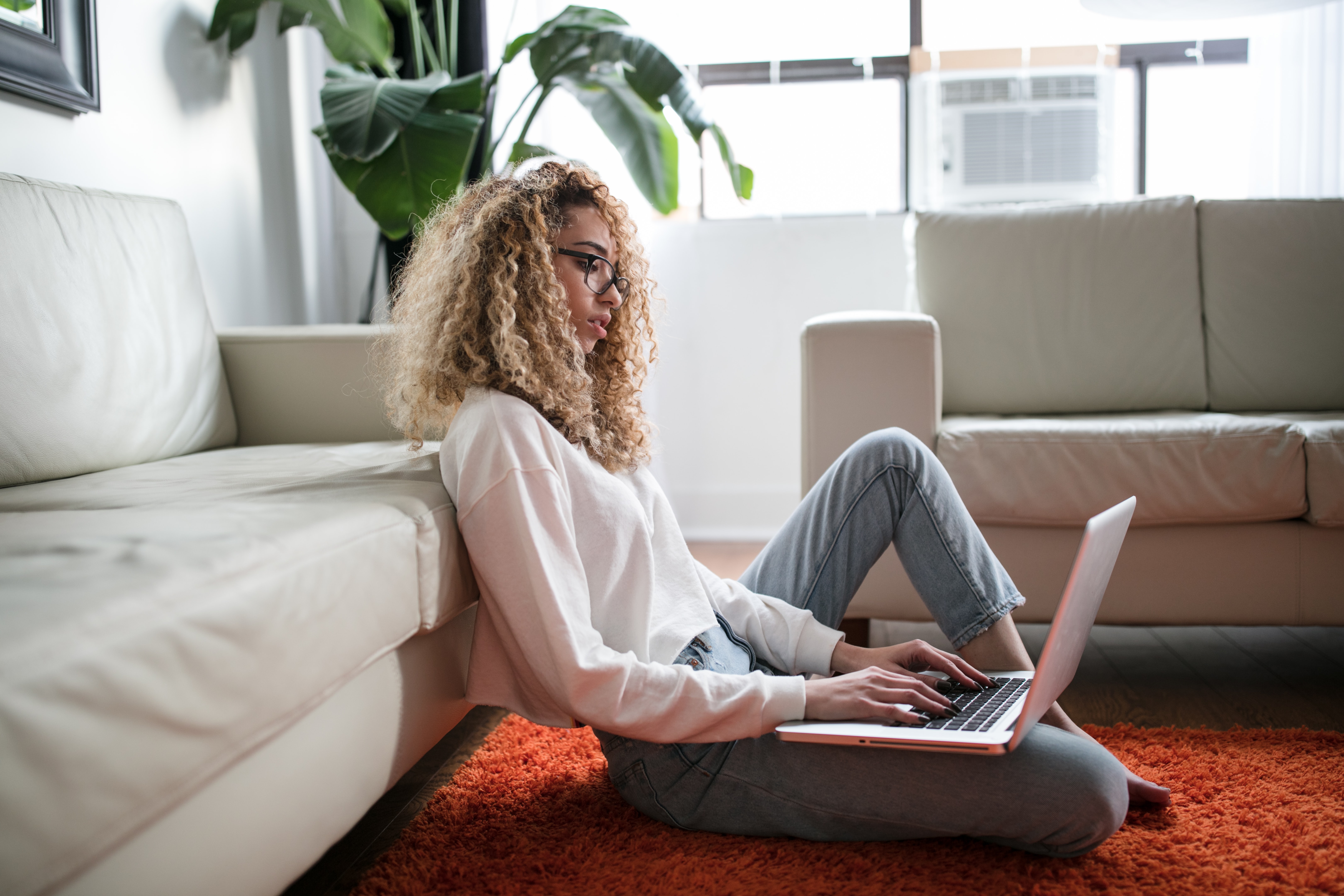Woman working from home with a laptop