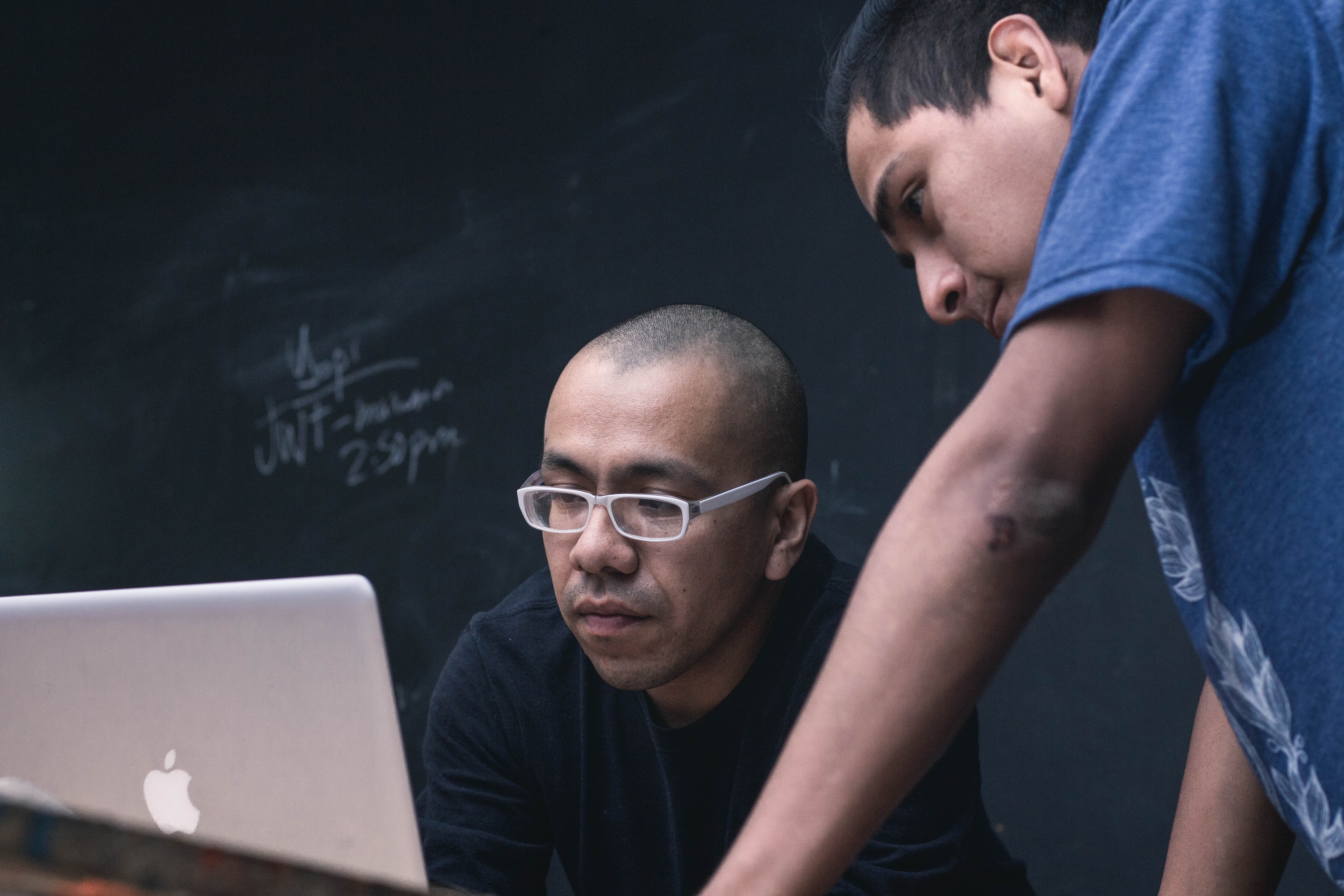 A manager explaining a concept to his coworker.