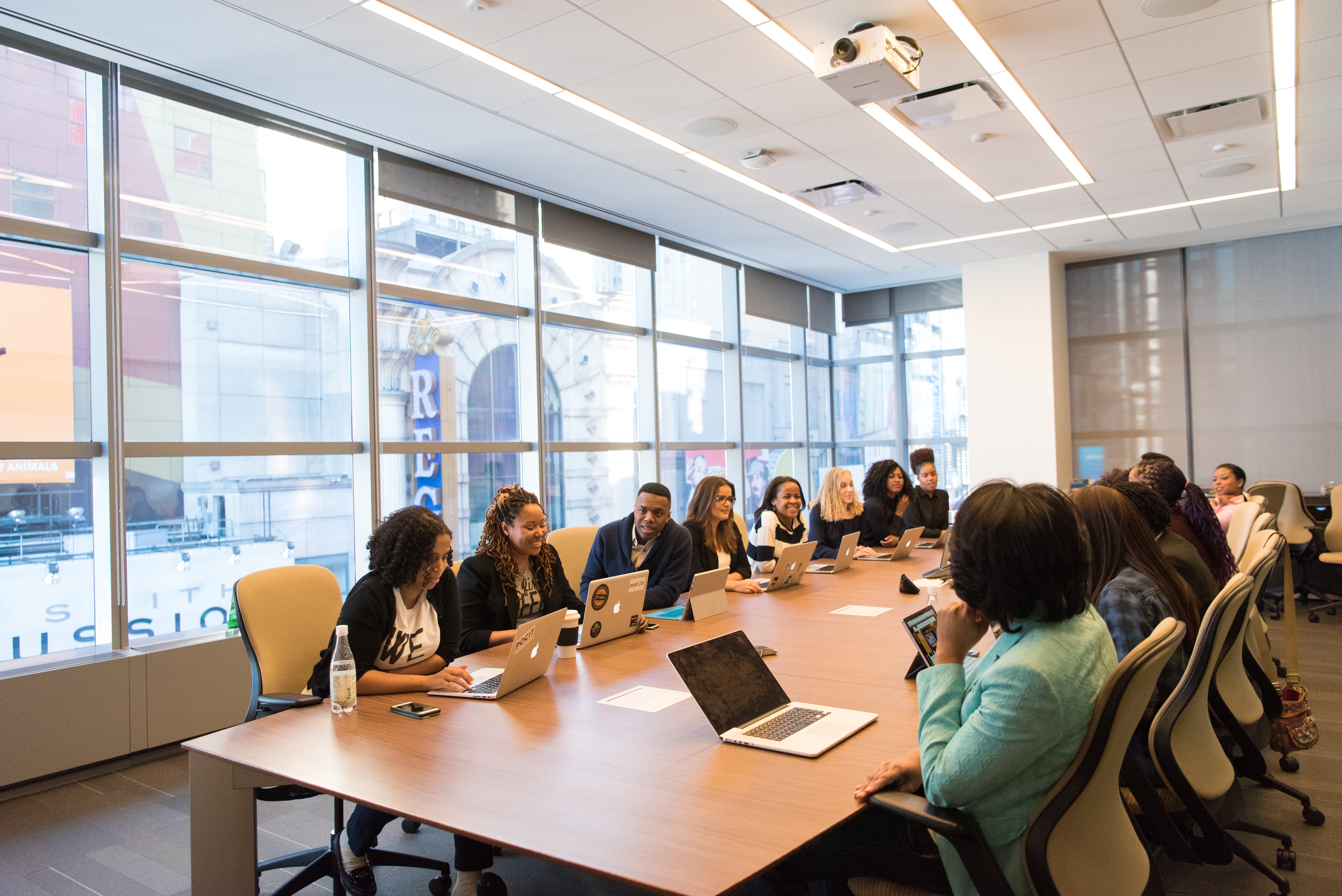 group or coworkers sitting together in a meeting room.