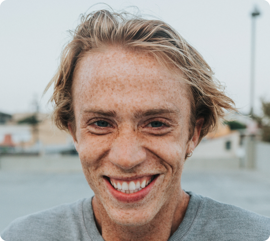 close up of a man looking into the camera and smiling