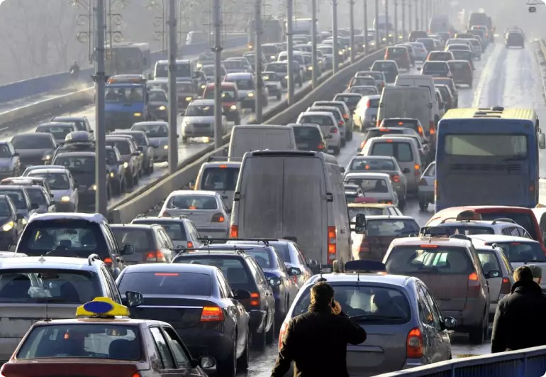 A highway in Providence, Rhode Island, clogged with bumper-to-bumper across three lanes in both directions.