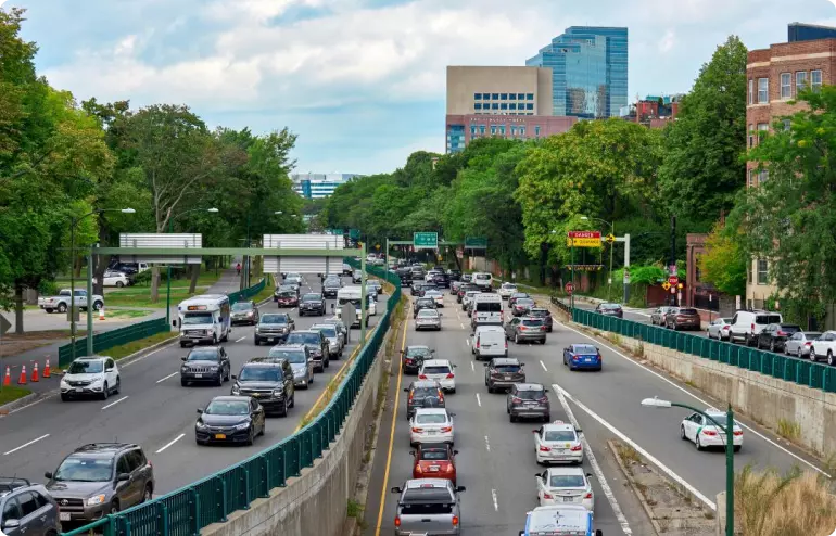 A busy, tree-lined road in Boston, Massachussetts.