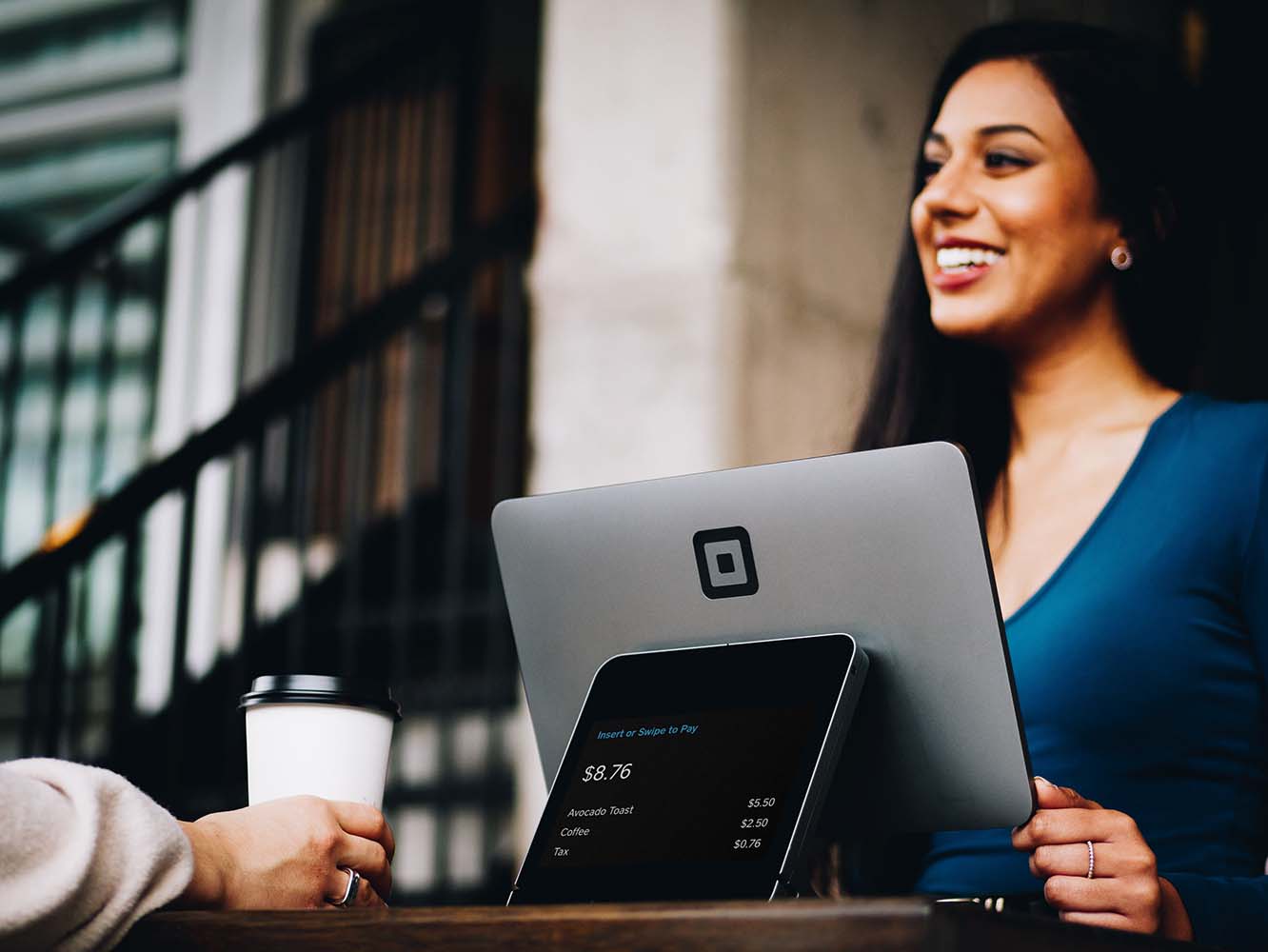 A lady on her laptop smiling