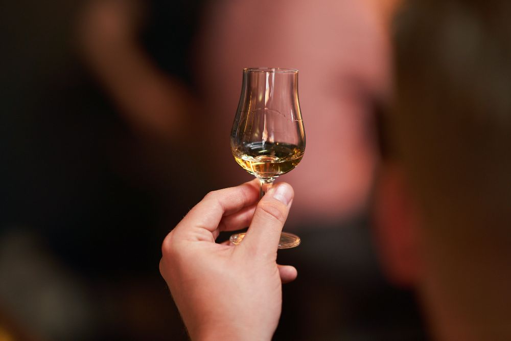 652d5b3ade01aa321c77e7c6 hand%20holdijng%20whisky%20dram