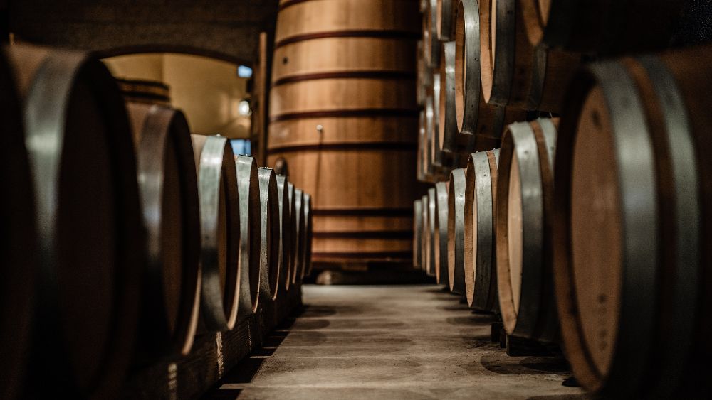 652ea2c528b2fd0b71fc763f whisky%20casks%20stored%20in%20warehouse