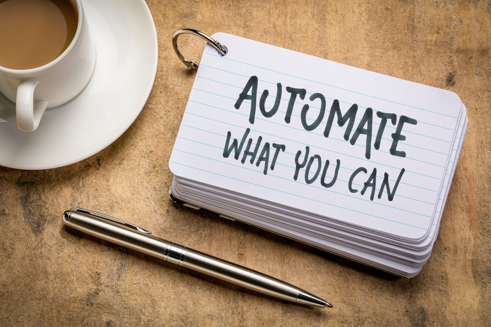 A stack of notecards on a desk, with the top one reading "Automate what you can"