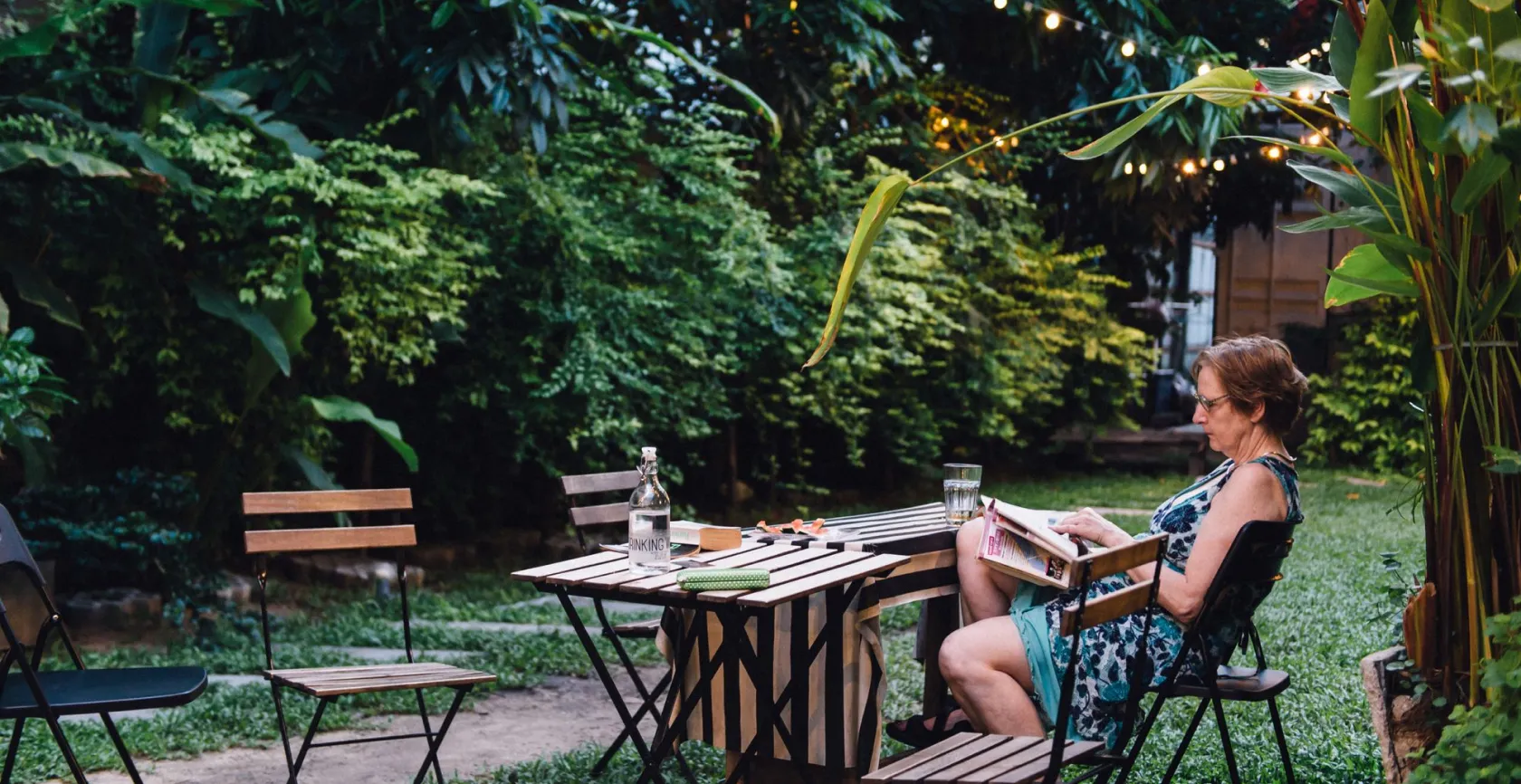 Read a book in the backyard of the Yard hostel
