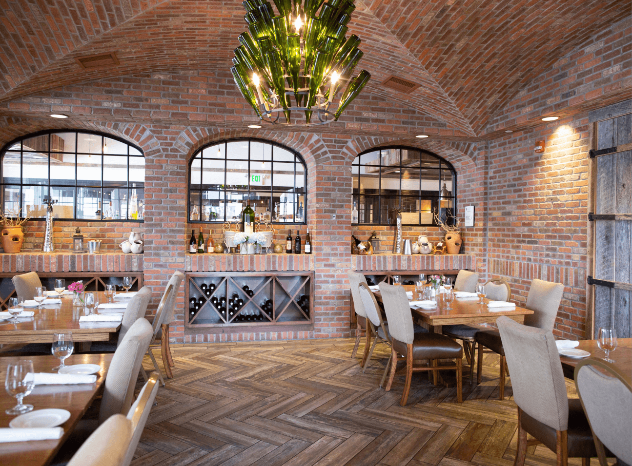 Coltivare restaurant private event space featuring brick walls and arches by Rocco Design + Build