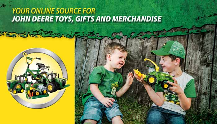 Two kids playing with John Deere toys