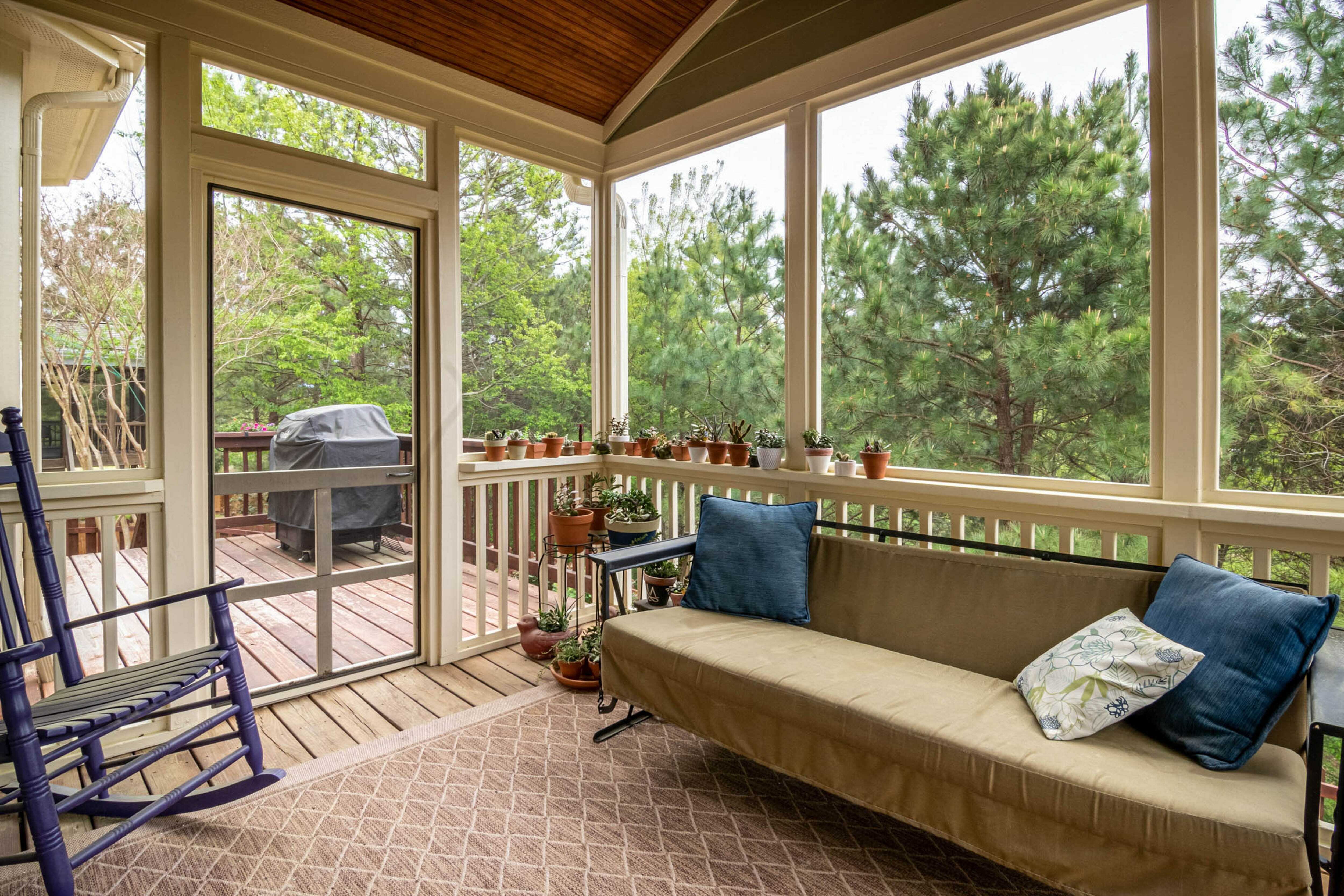 A screened room with large windows