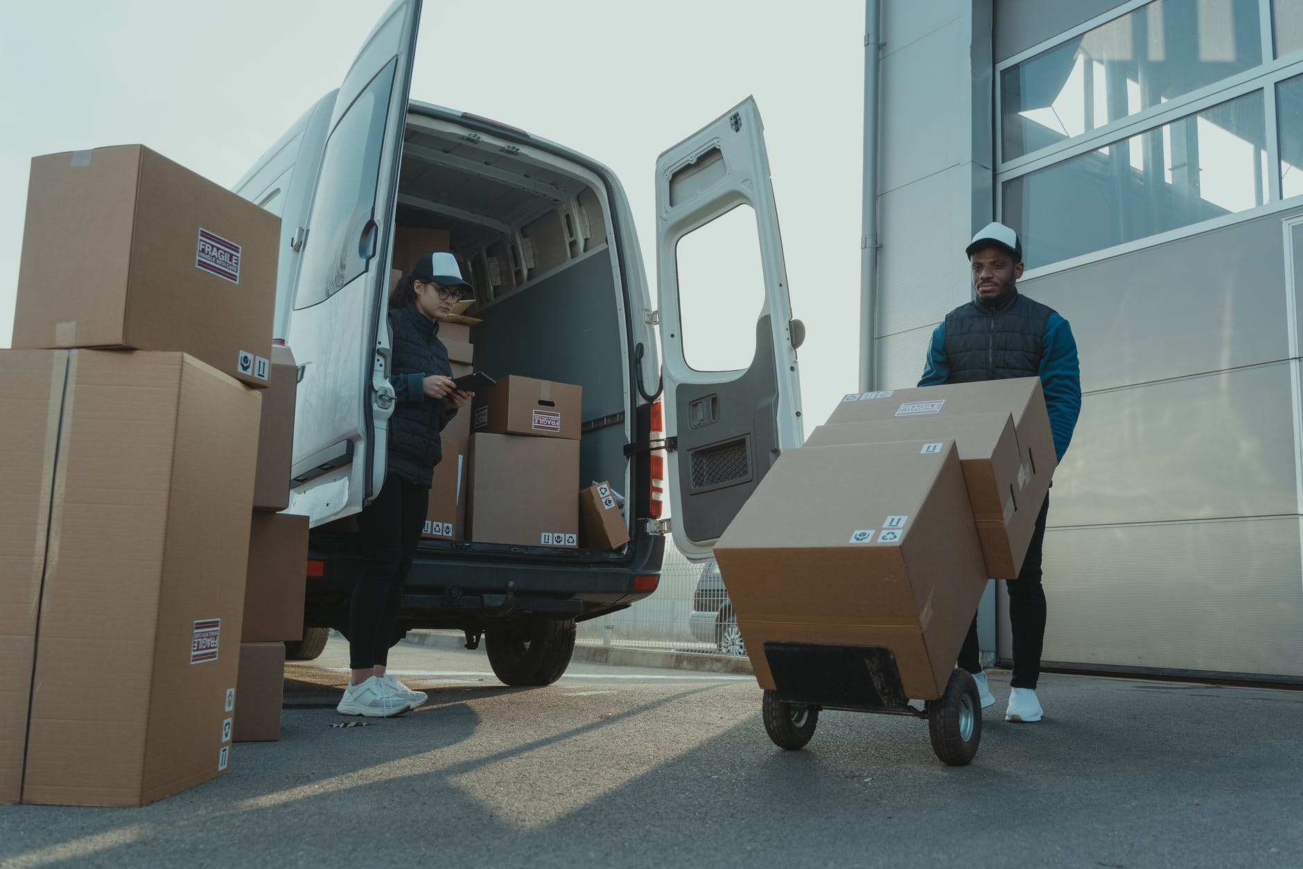 a man and a woman working for a delivery company