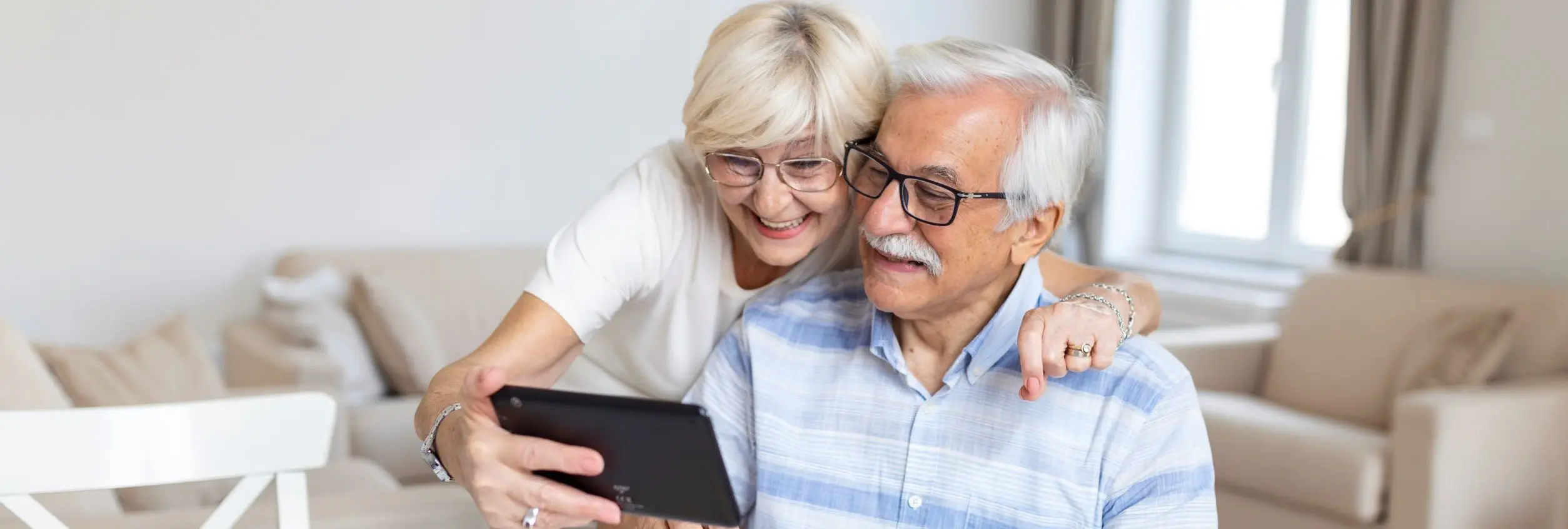 older couple sitting on the sofa