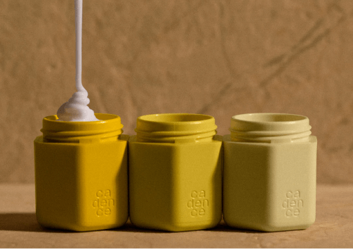 Cream being poured into jar