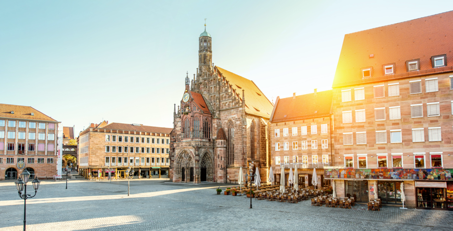 The Frauenkirche in Nuremberg with the sun setting behind it.