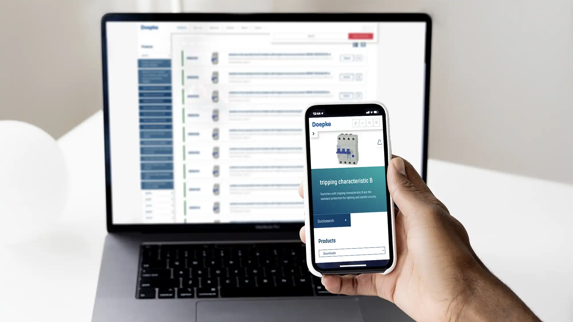 Doepke website on a desktop screen with a hand