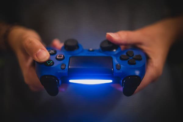 Image of a person holding a gaming controller