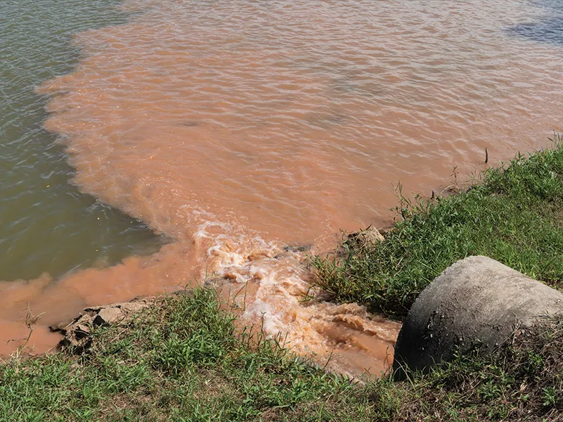 Sediment flowing out of a drain