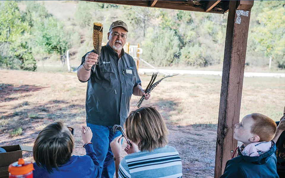 Wild turkey foundation man speaking to kids