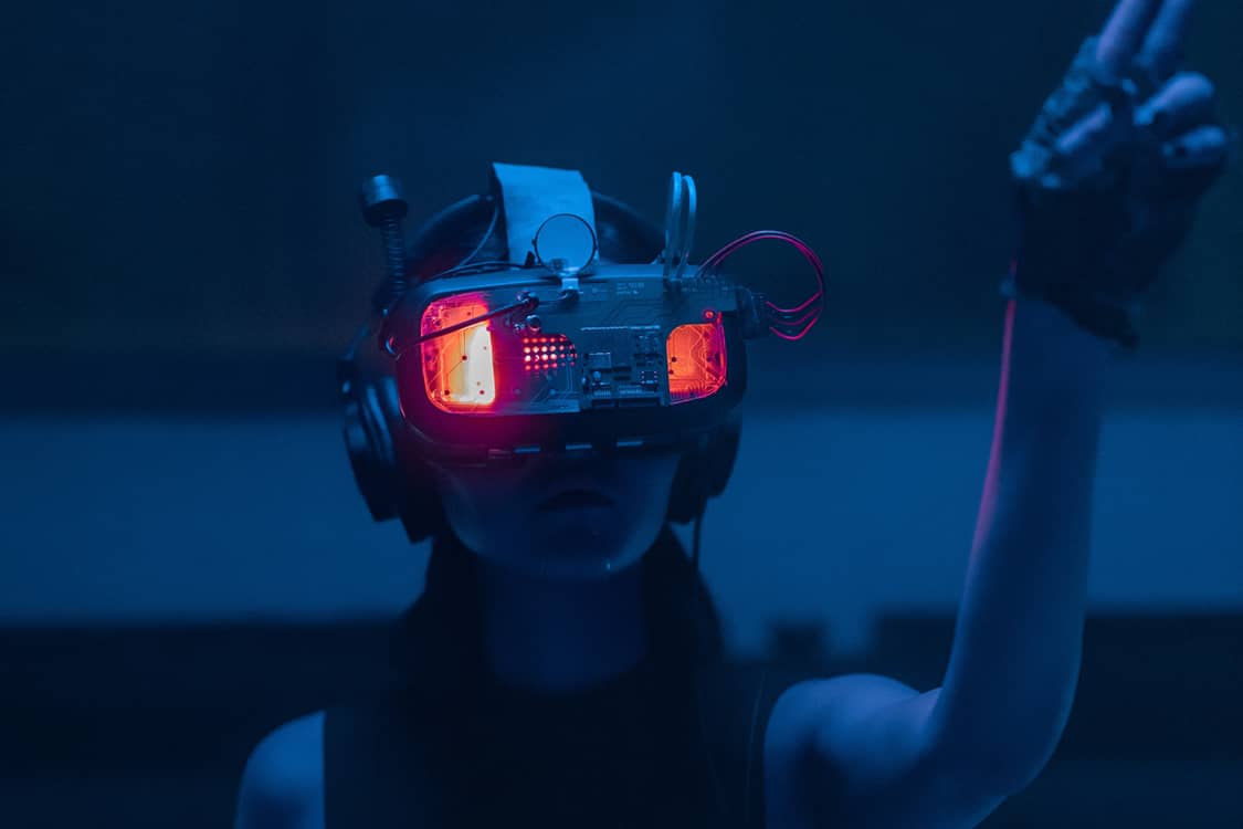 Cyberpunk photo of a person in futuristic gogles.