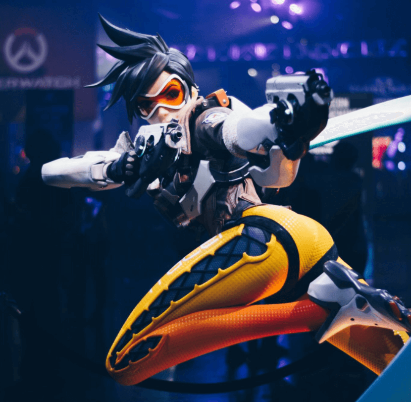 Overwatch character shooting gun with dark background in behind one of Serenity esports canada games