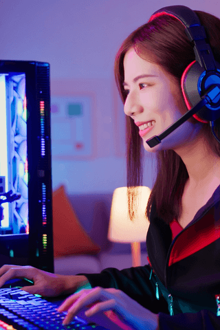 Female esports teams member playing games on keyboard 