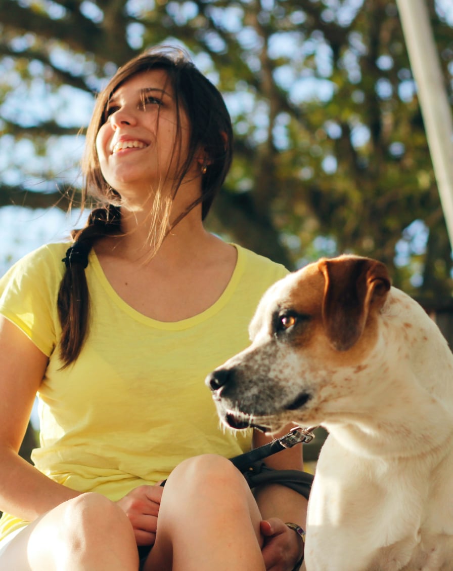 image of woman sitting with a dog