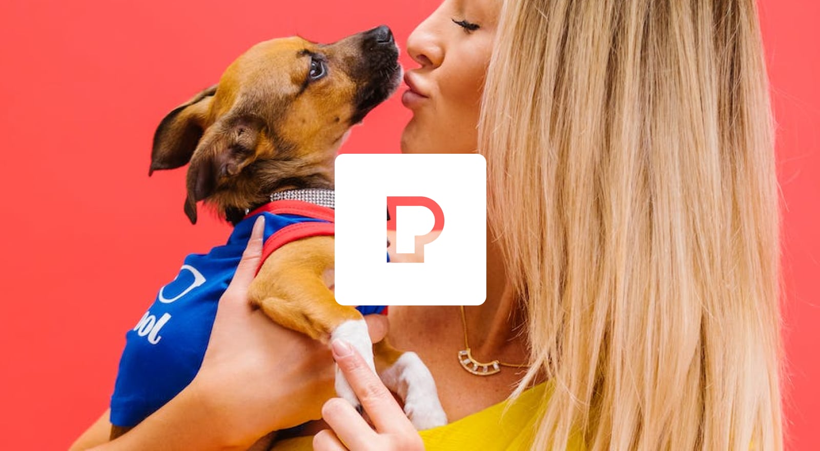 woman holding dog with pexels logo overlay