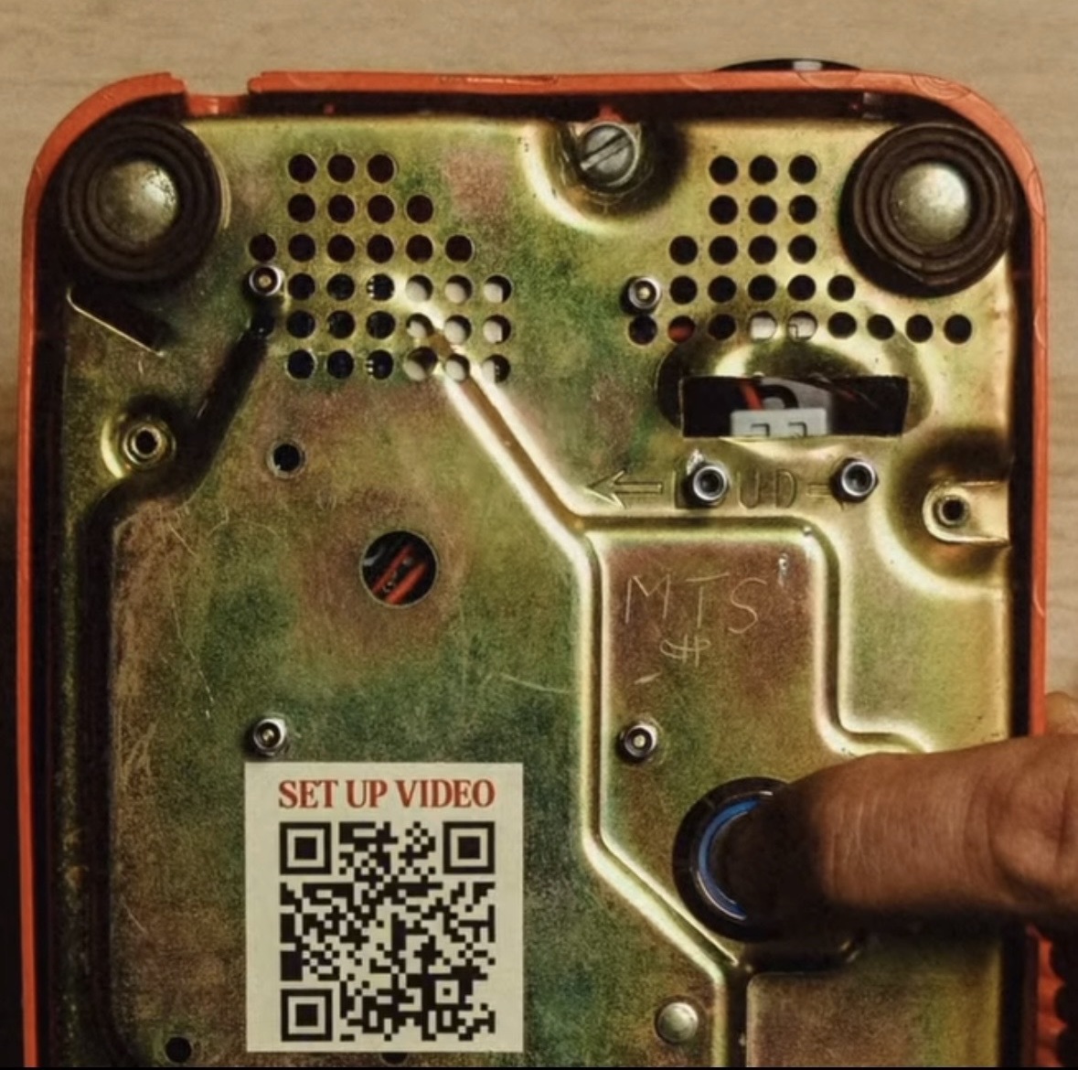 Orange rotary phone power button on the bottom