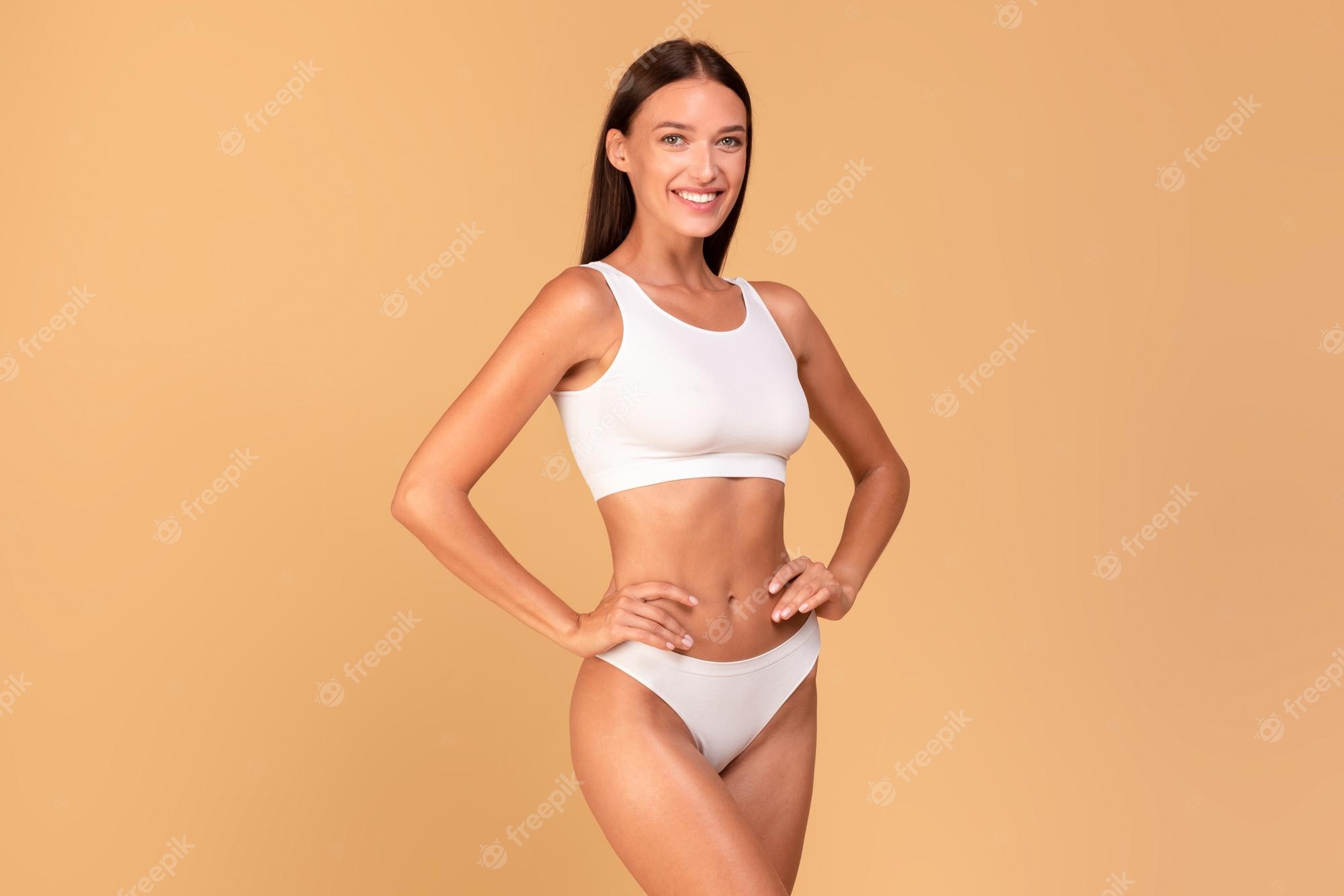 Premium Photo | Body slimming concept happy lady with slim figure in white  underwear smiling at camera over beige studio background