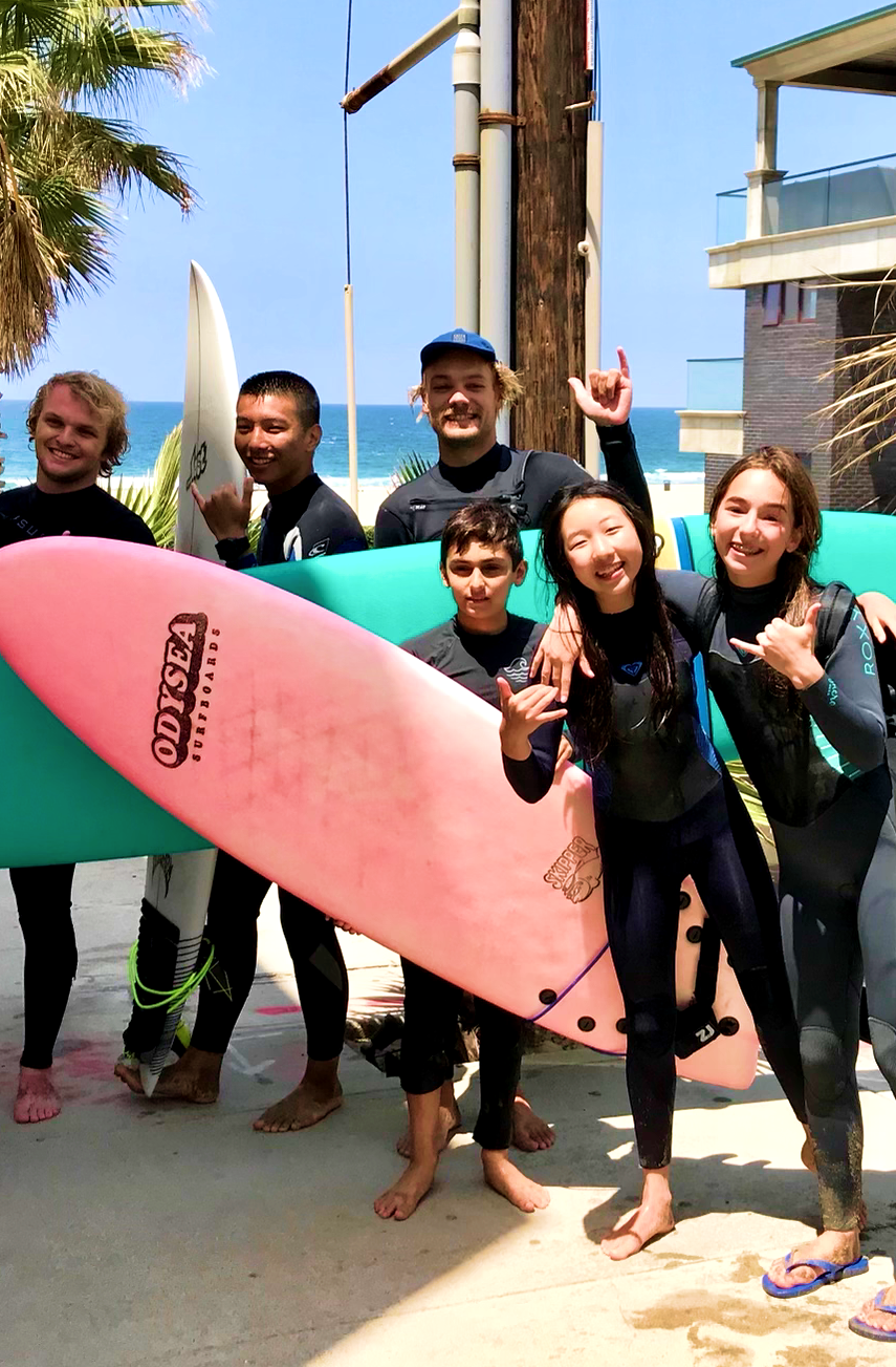 A group of surfers.