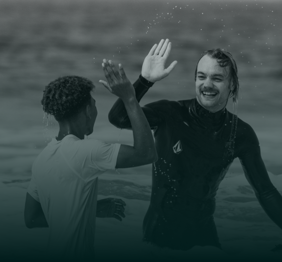 Two people high-fiving each other.