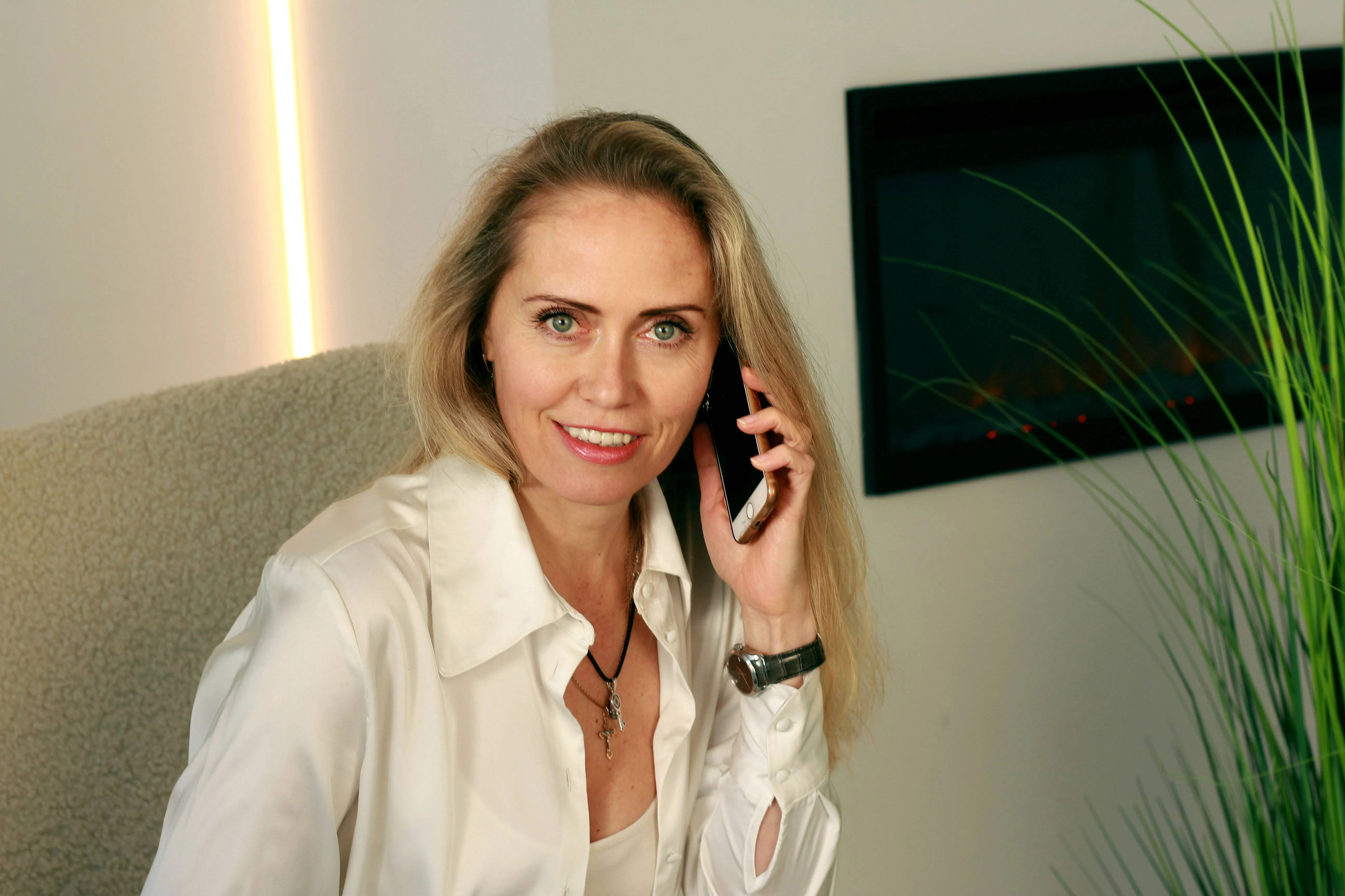 a woman holding a phone carrier consultation 