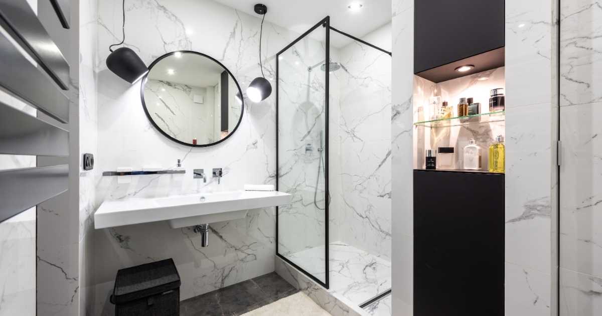 Modern bathroom interior with mirror between modern pendant lights at home