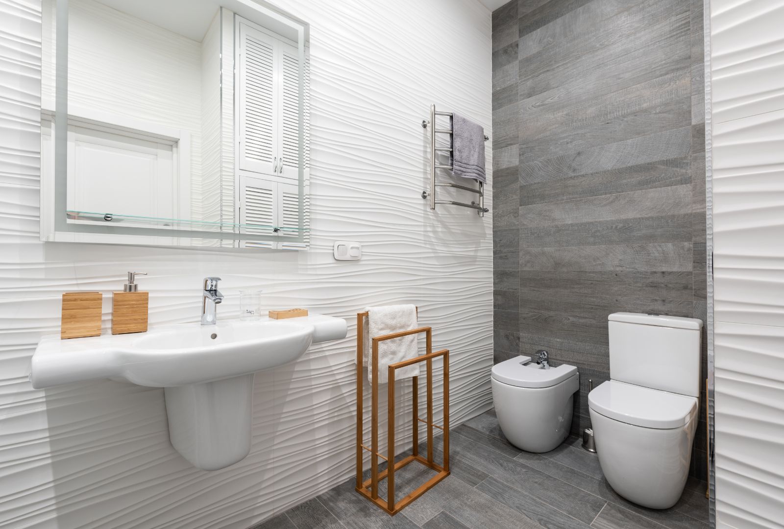 Contemporary bathroom interior with washbasin and toilet bowl